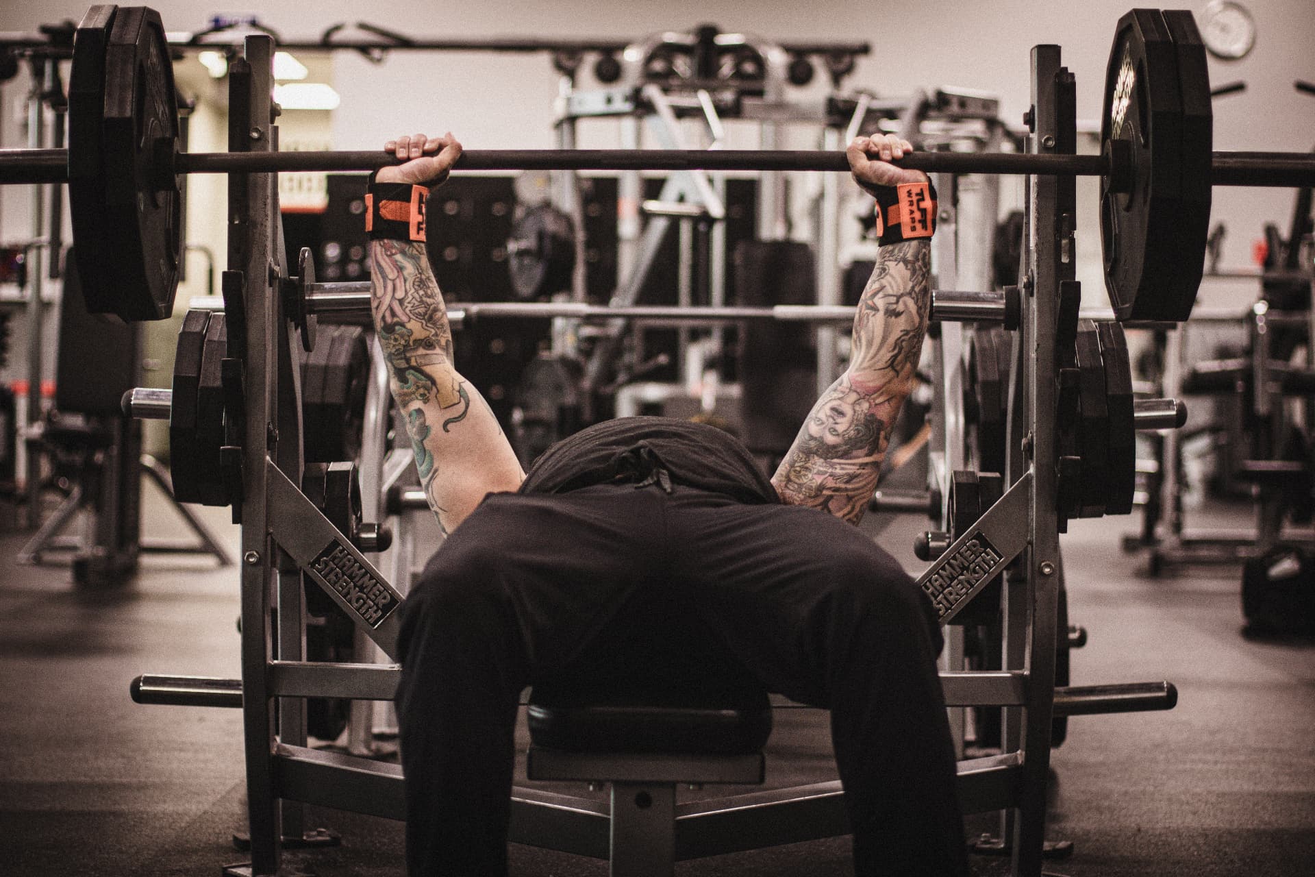 Black and white overhead photograph of a lifter bench pressing